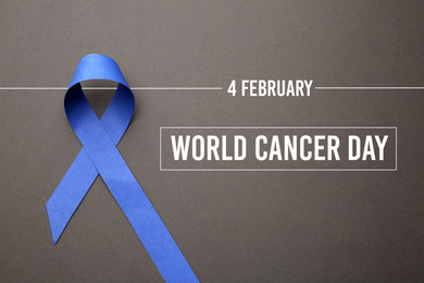 Image of Blue ribbon on grey background, top view. World Cancer Day