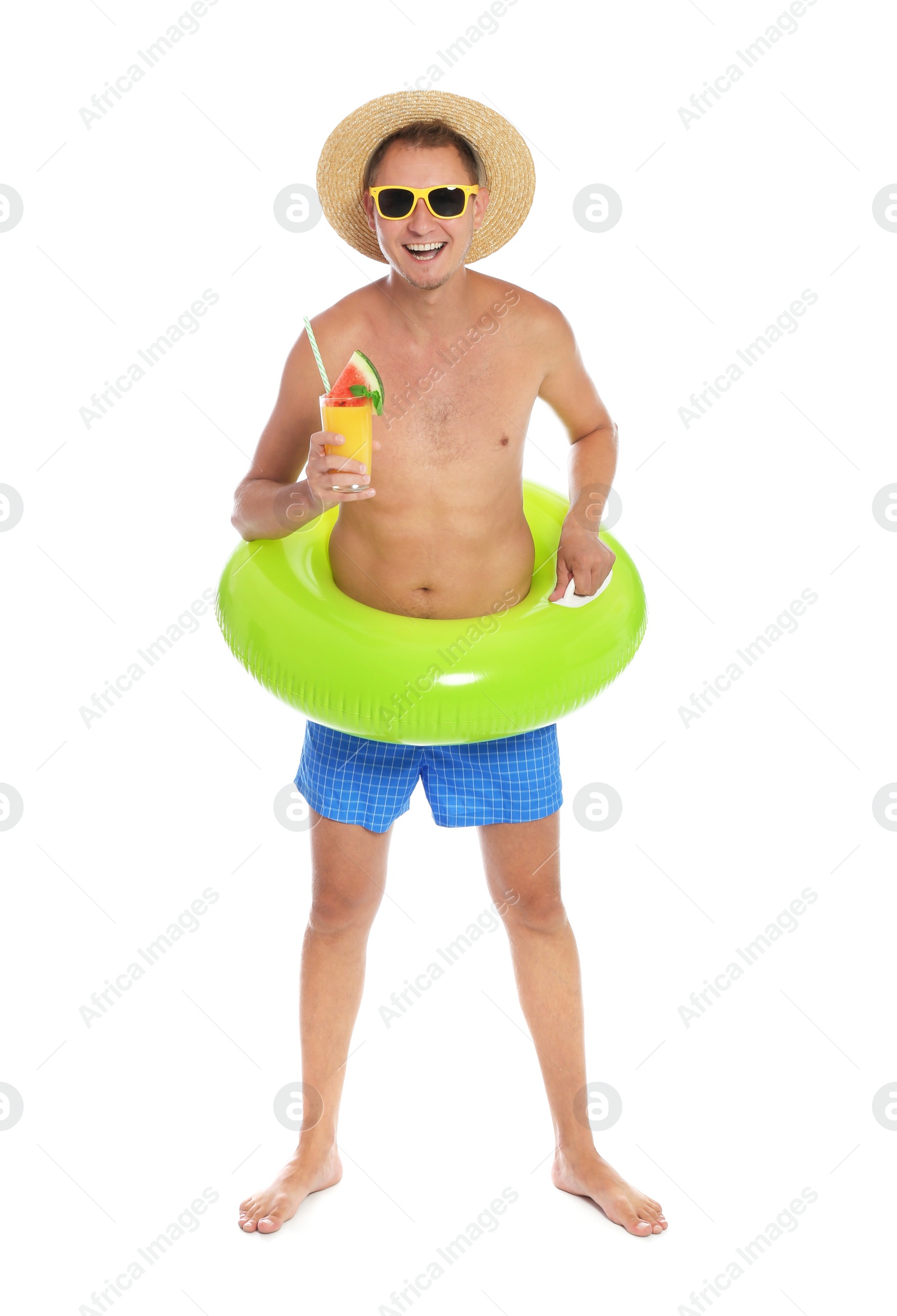 Photo of Shirtless man with inflatable ring and glass of cocktail on white background