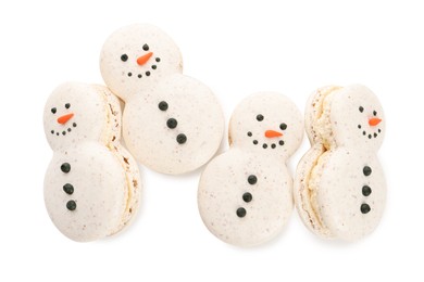 Beautifully decorated Christmas macarons on white background, top view