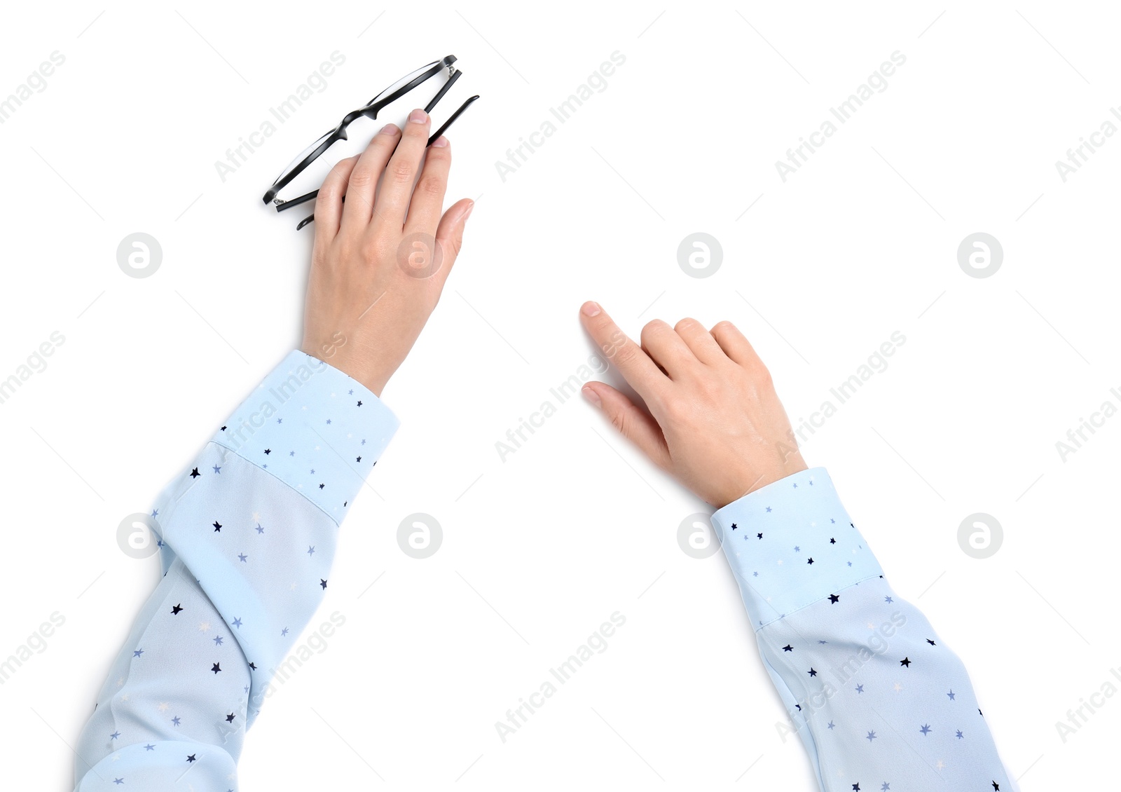 Photo of Woman holding eyeglasses on white background, top view