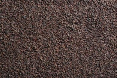 Photo of Pile of black salt as background, top view