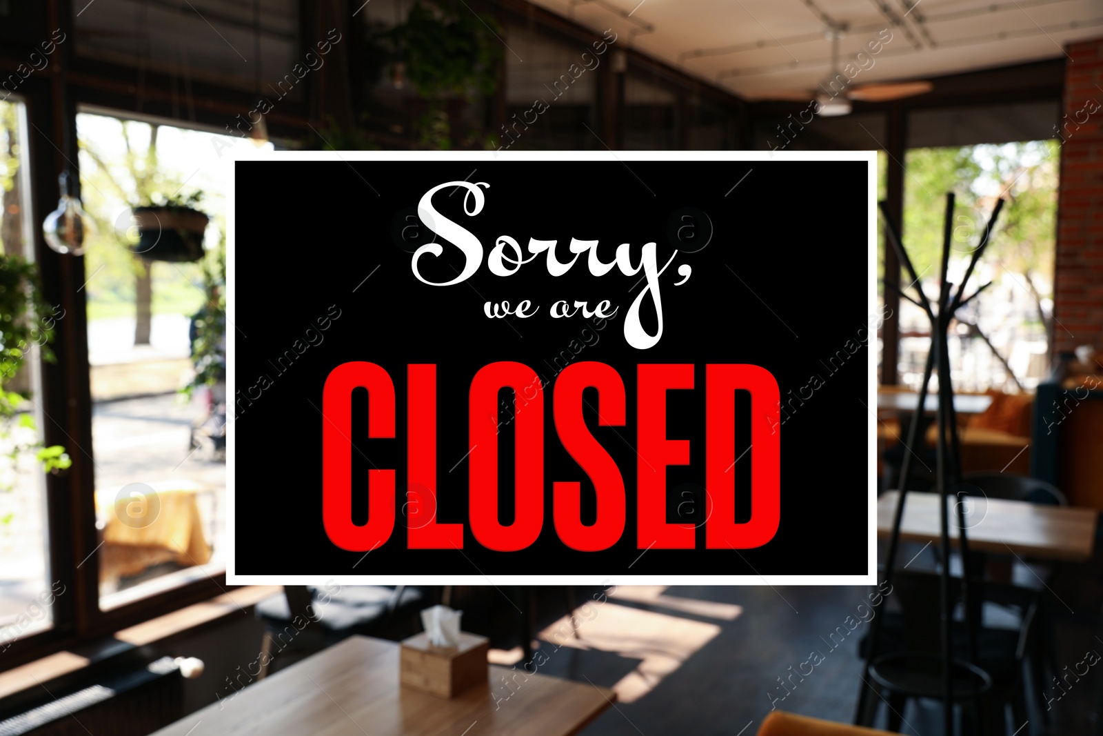 Image of Sorry we are closed sign against blurred background