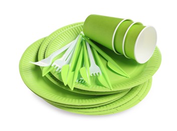 Photo of Set of bright disposable tableware on white background