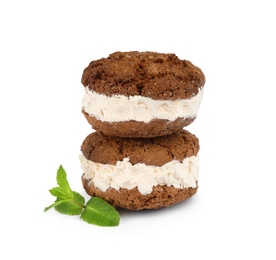 Photo of Sweet delicious ice cream cookie sandwiches and mint on white background