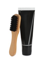 Photo of Brush and shoe care product on white background