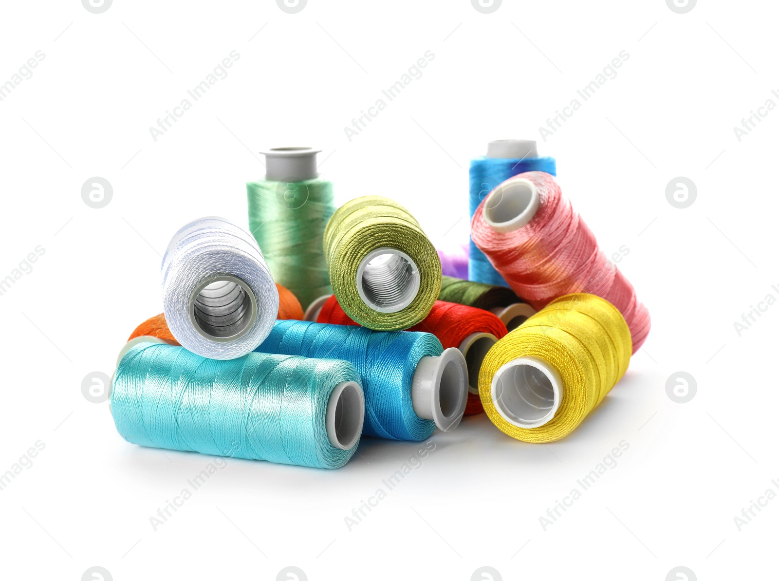 Photo of Color sewing threads on white background