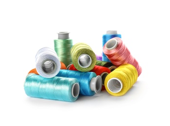 Photo of Color sewing threads on white background