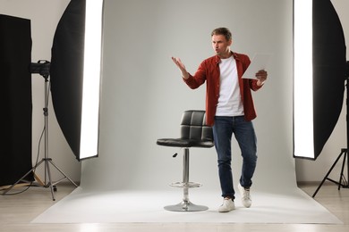 Photo of Casting call. Man with script performing in studio
