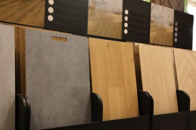 Photo of Many different samples of wooden flooring in store