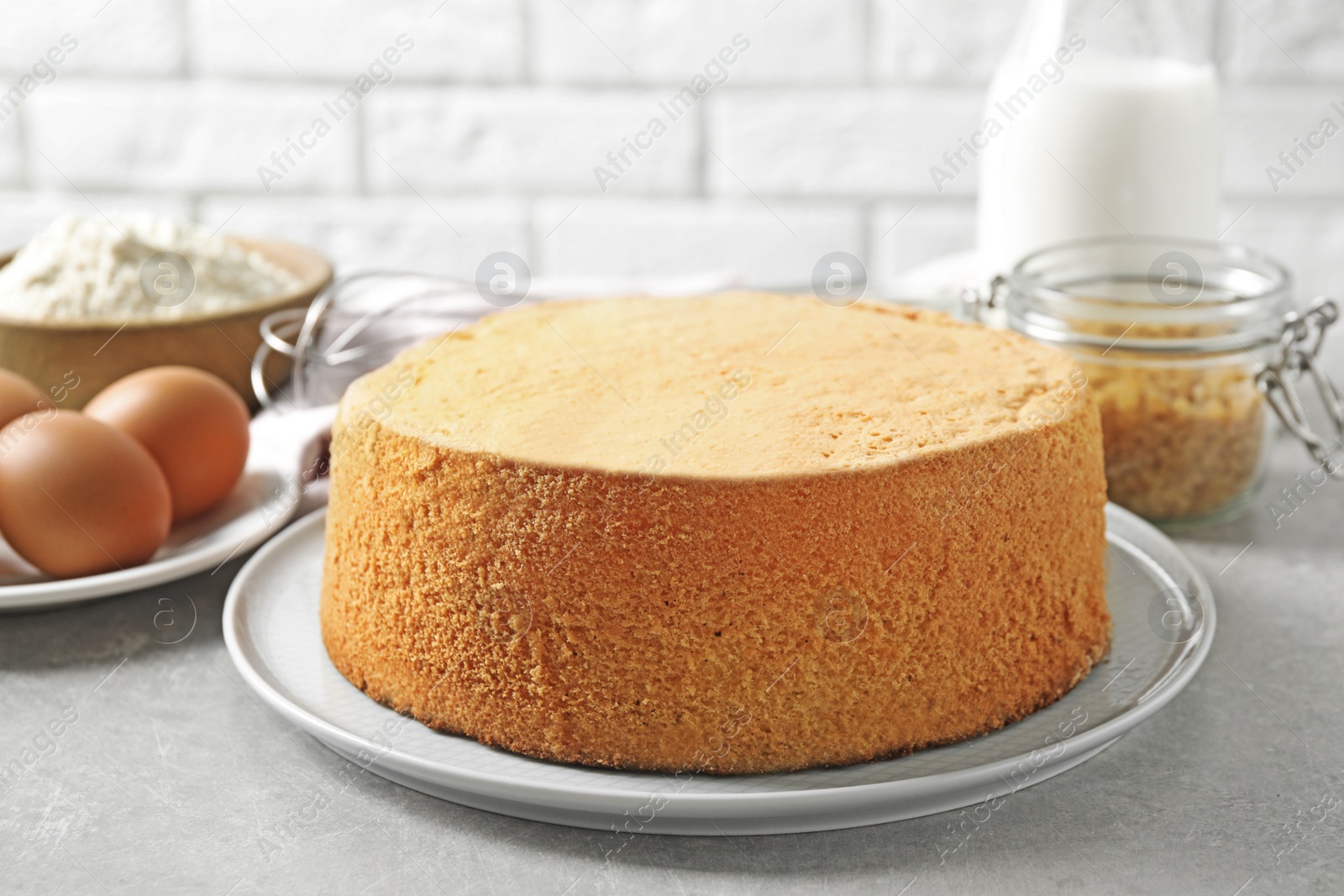 Photo of Delicious fresh homemade cake on light grey marble table