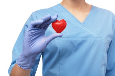 Photo of Doctor holding red heart on white background, closeup. Cardiology concept