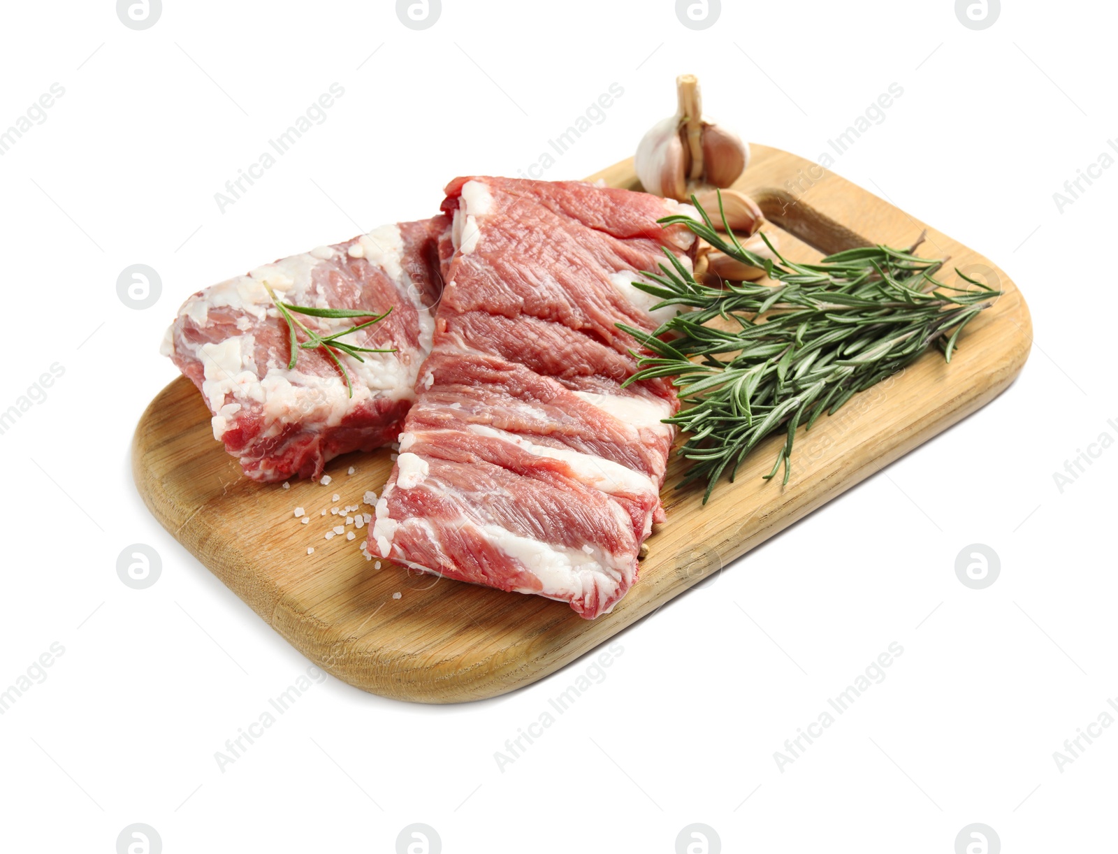 Photo of Raw ribs with rosemary and salt isolated on white