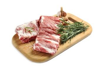 Photo of Raw ribs with rosemary and salt isolated on white