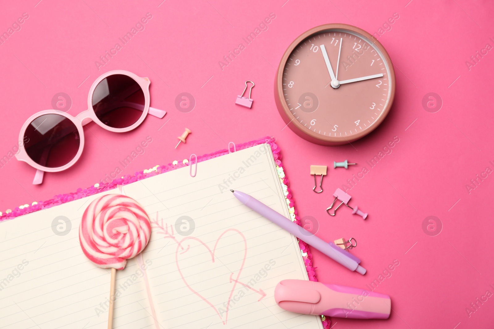 Photo of Flat lay composition with heart drawn in notebook on pink background