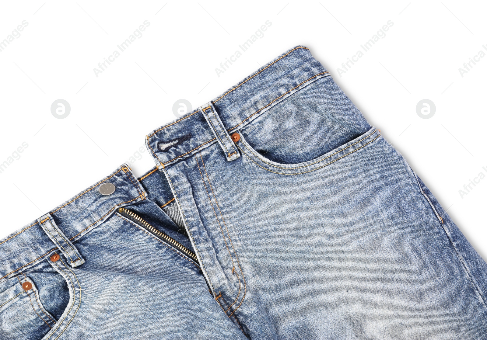 Photo of Stylish light blue jeans isolated on white, top view