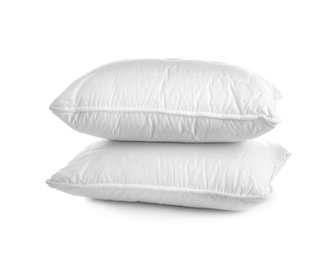 Clean soft bed pillows on white background