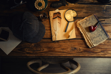 Photo of Flat lay composition with vintage detective items on wooden table