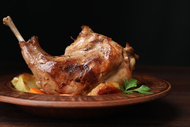 Tasty cooked rabbit meat with potatoes on table, closeup