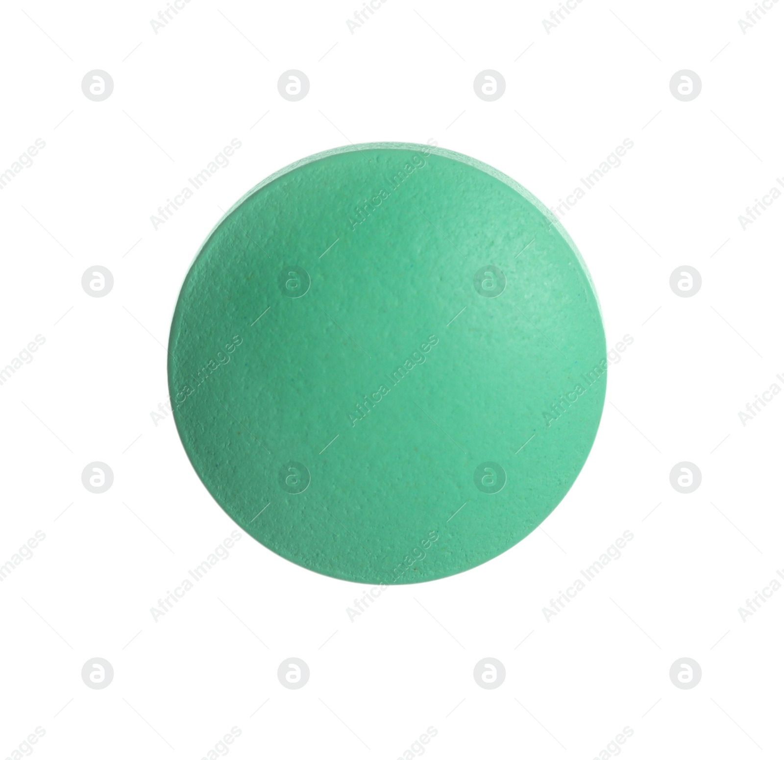 Photo of One green pill on white background. Medicinal treatment