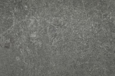 Photo of Texture of grey stone surface as background, closeup