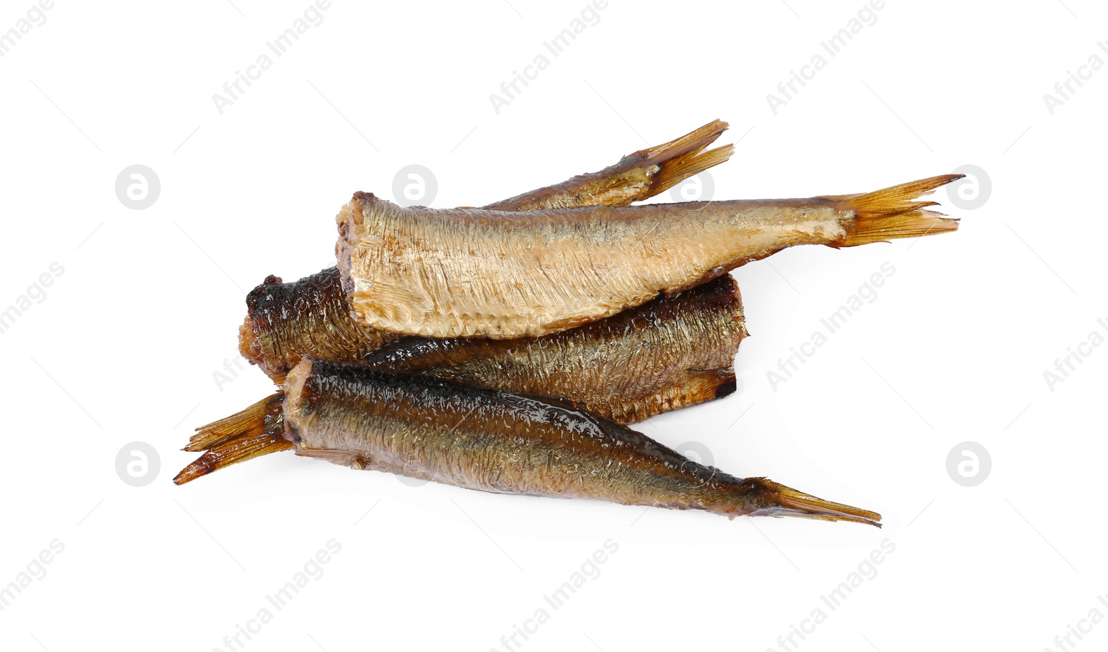 Photo of Many tasty smoked sprats isolated on white, top view