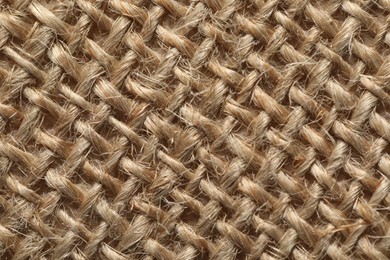 Photo of Texture of light brown fabric as background, top view