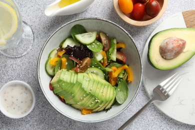 Photo of Healthy dish high in vegetable fats served on light textured table, flat lay