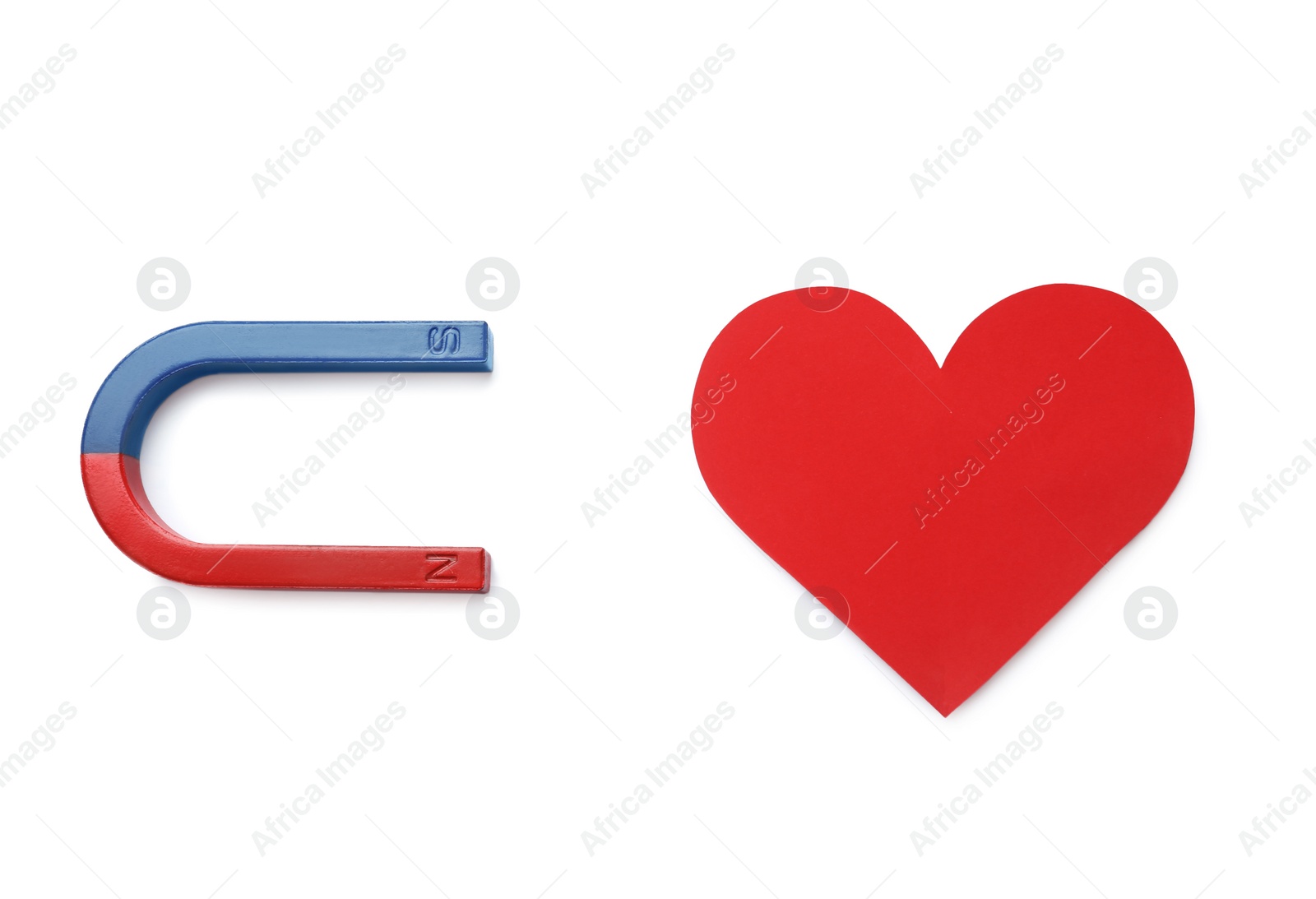 Photo of Magnet attracting red heart on white background, top view. Love concept