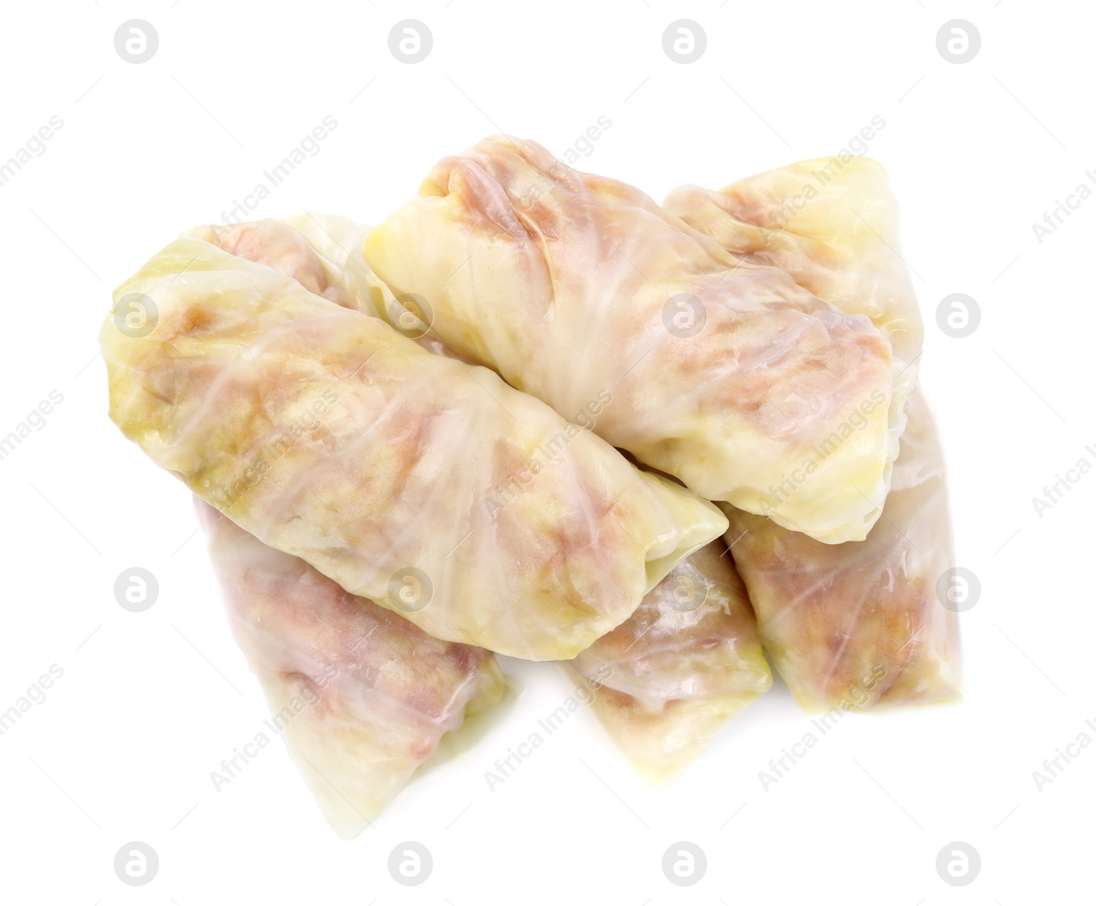 Photo of Uncooked stuffed cabbage rolls isolated on white, top view