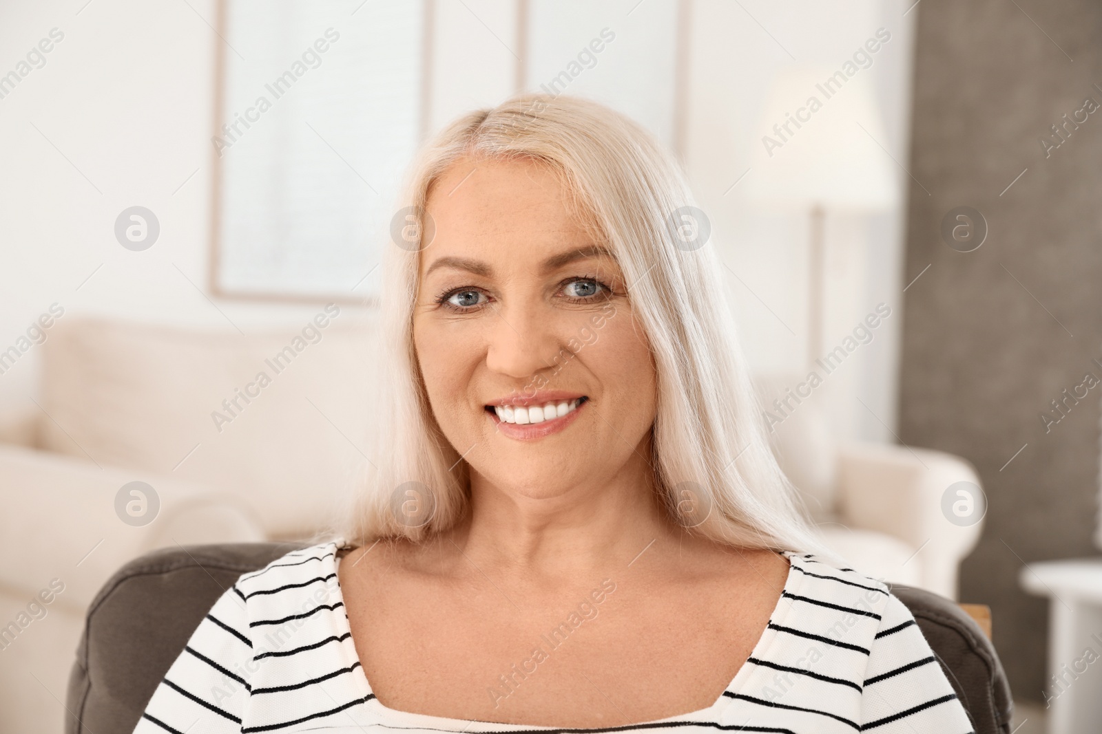 Photo of Portrait of mature woman with beautiful face indoors