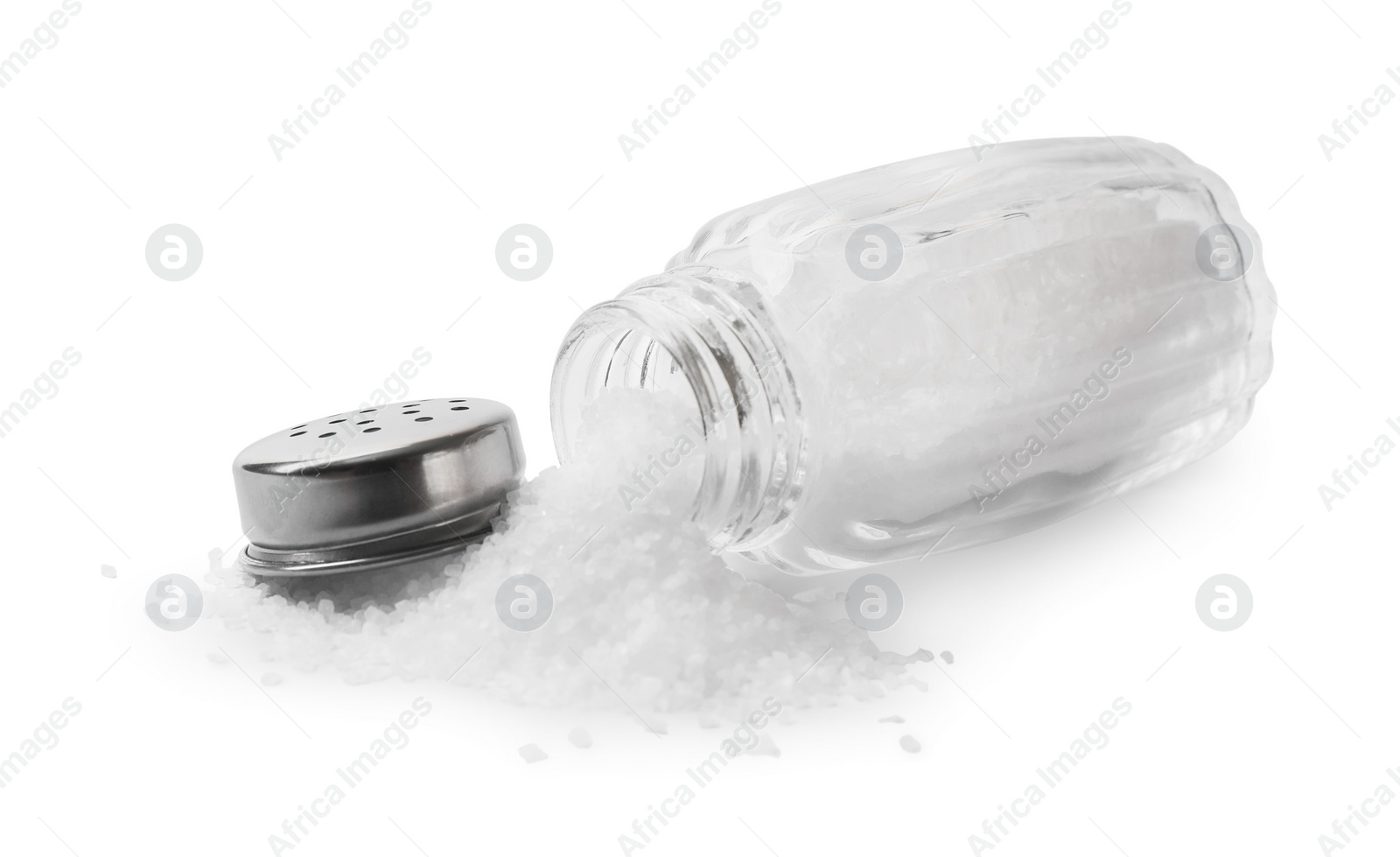 Photo of Natural salt in shaker isolated on white