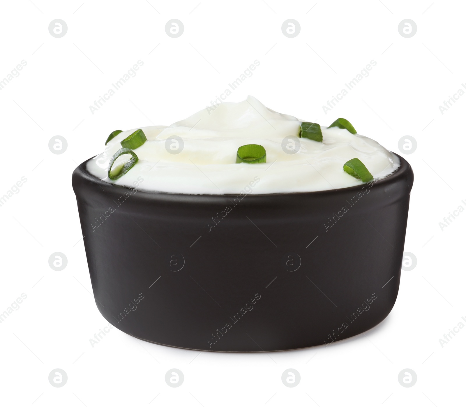 Photo of Delicious sour cream with onion in bowl isolated on white