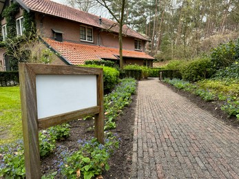 Luxury hotel, pathway and sign board outdoors