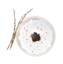 Photo of Easter cake with sprinkles and willow branches isolated on white, top view