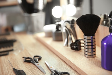 Photo of Hairdresser tools on table in salon