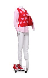 Photo of Female mannequin dressed in sweater vest, shirt and pants with bag and sneakers isolated on white. Stylish outfit