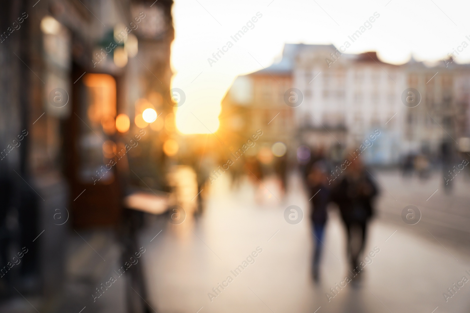 Photo of Blurred view of people walking on city street