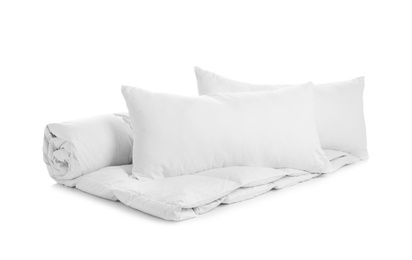 Photo of Soft blanket and pillows on white background