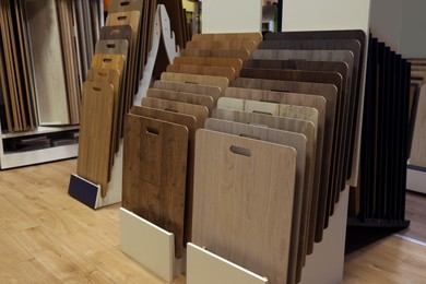 Photo of Many different samples of wooden flooring in store