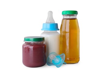 Photo of Healthy baby food, bottles with juice, milk and pacifier on light grey background