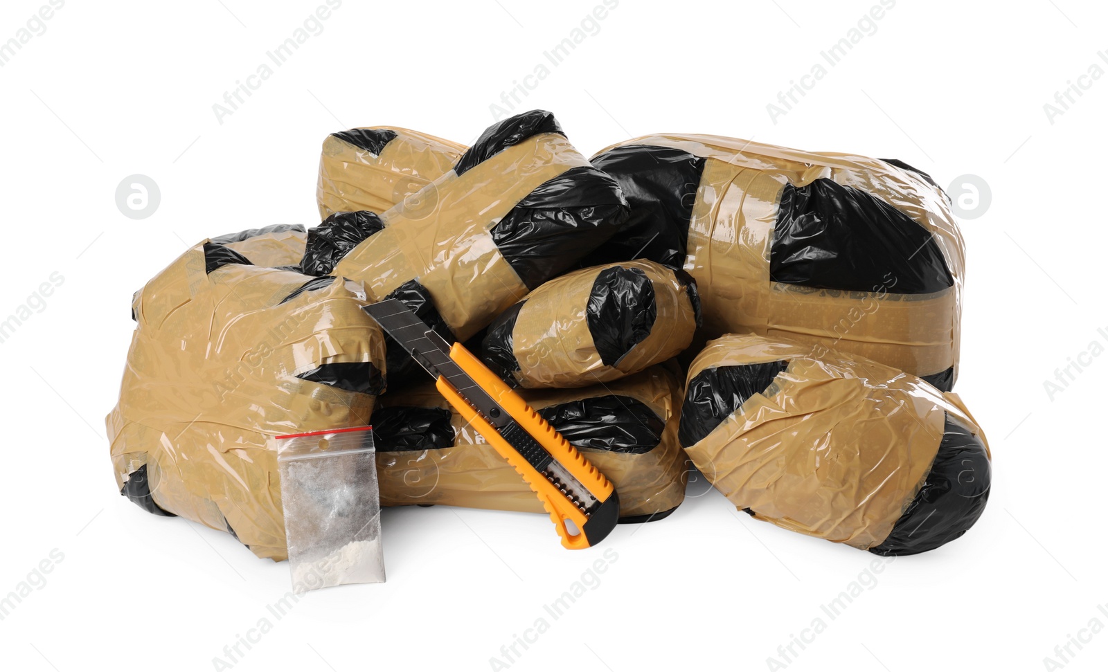 Photo of Packages with narcotics and stationery knife isolated on white