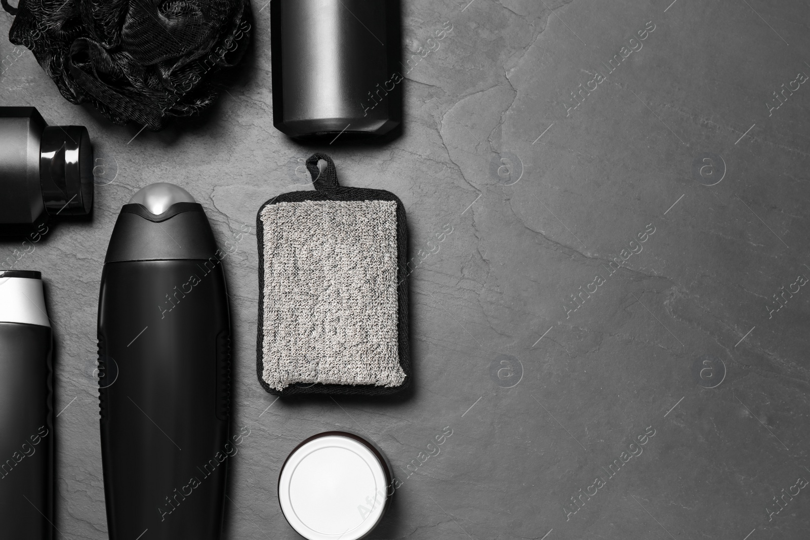 Photo of Flat lay composition with men's cosmetic products on grey background. Space for text