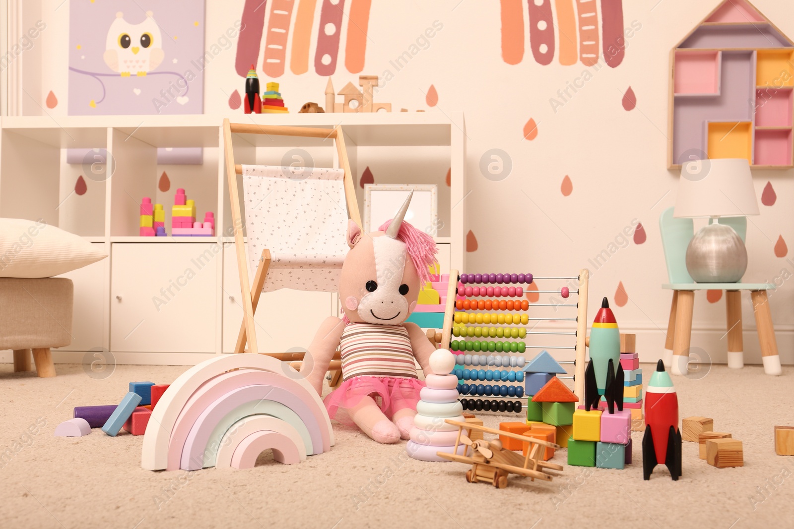 Photo of Many different toys on floor in child's room