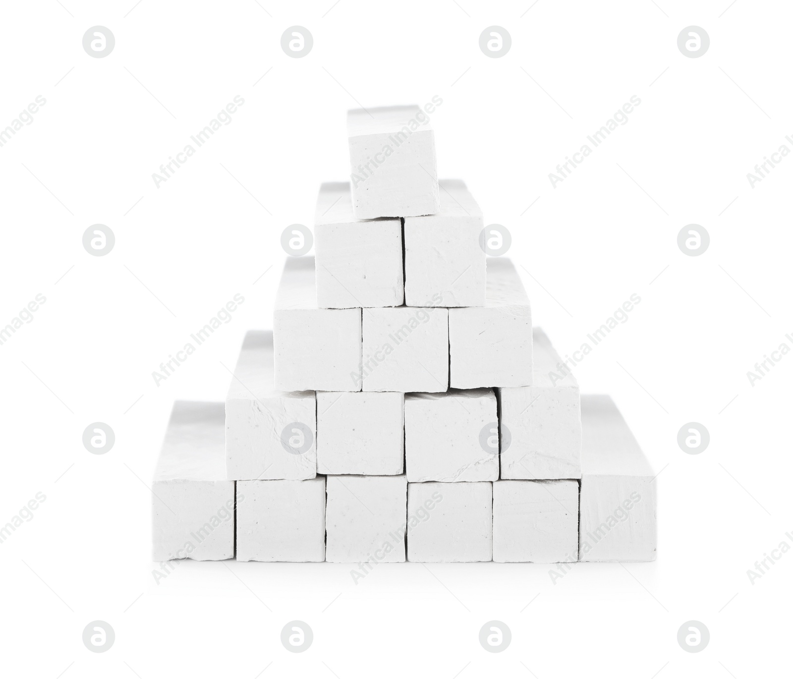 Photo of Small pieces of chalk on white background