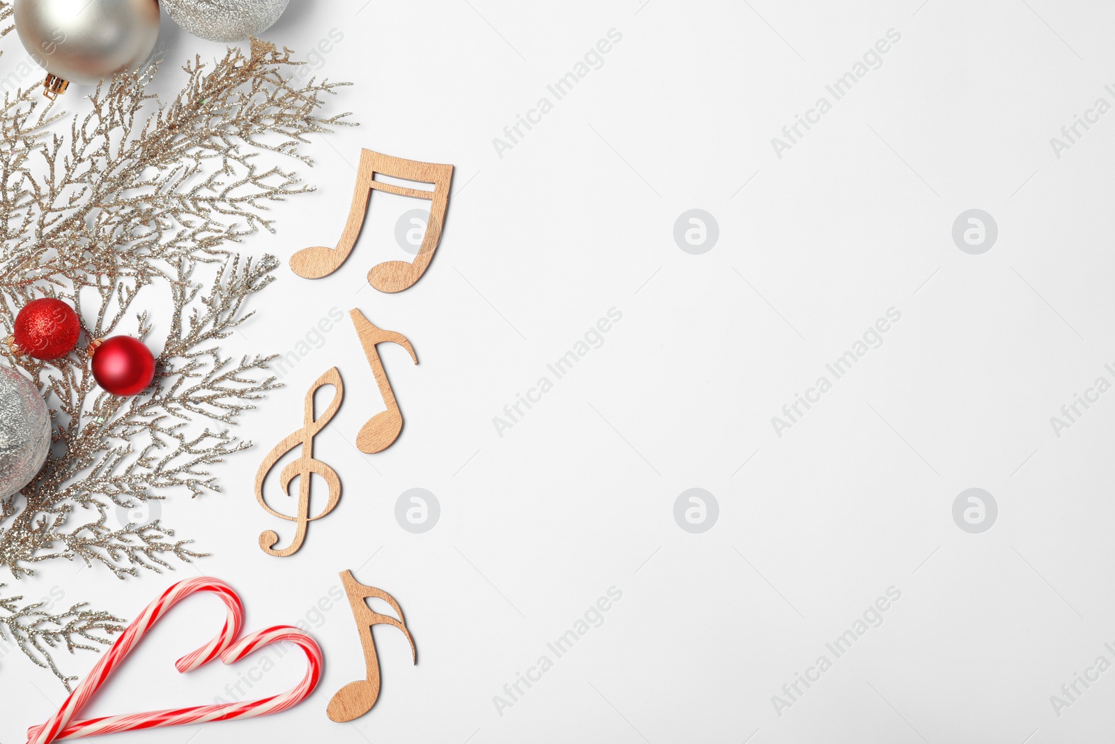 Photo of Composition with wooden music notes and space for text on white background, top view