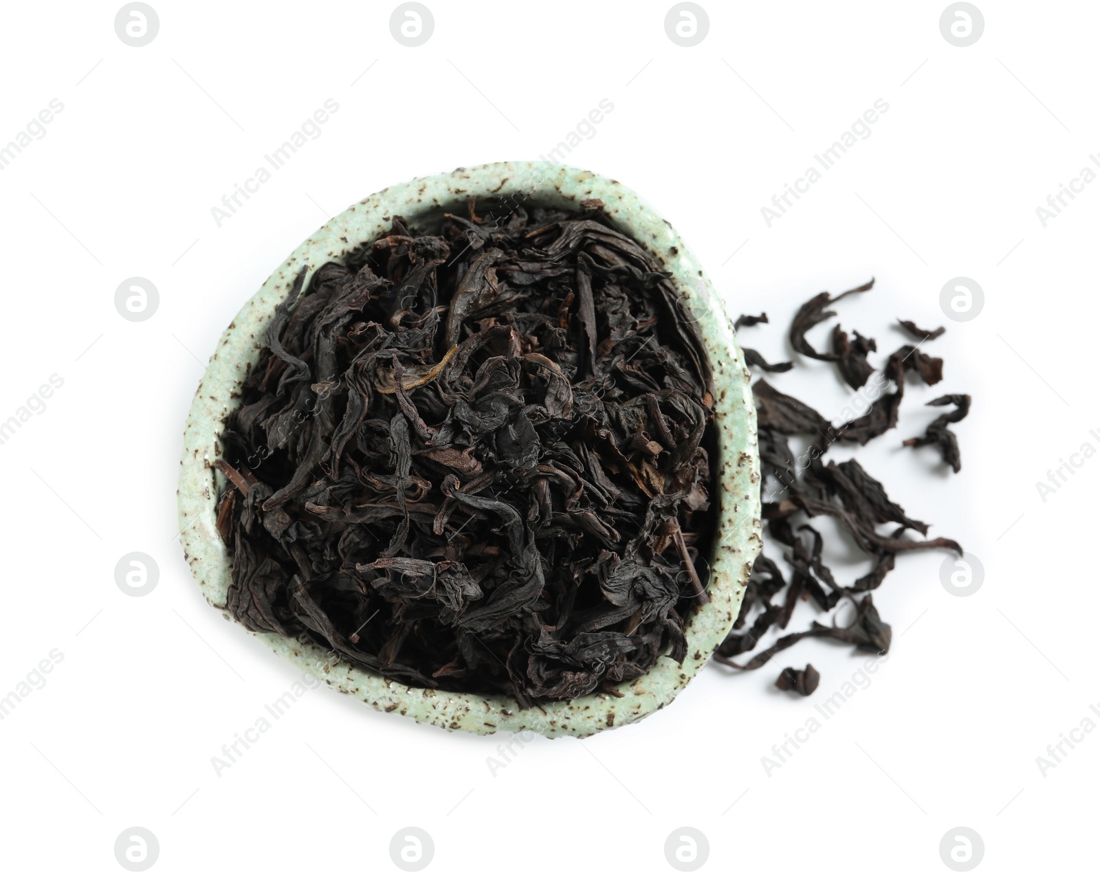 Photo of Bowl with Da Hong Pao Oolong tea on white background, top view