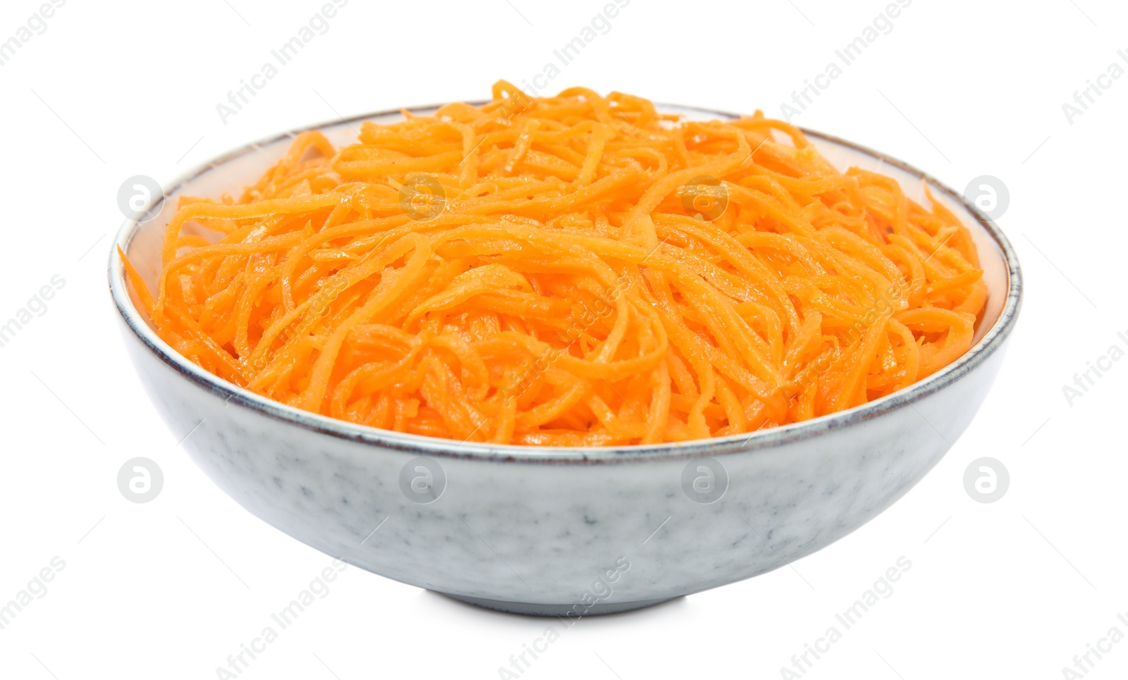 Photo of Delicious Korean carrot salad in bowl isolated on white