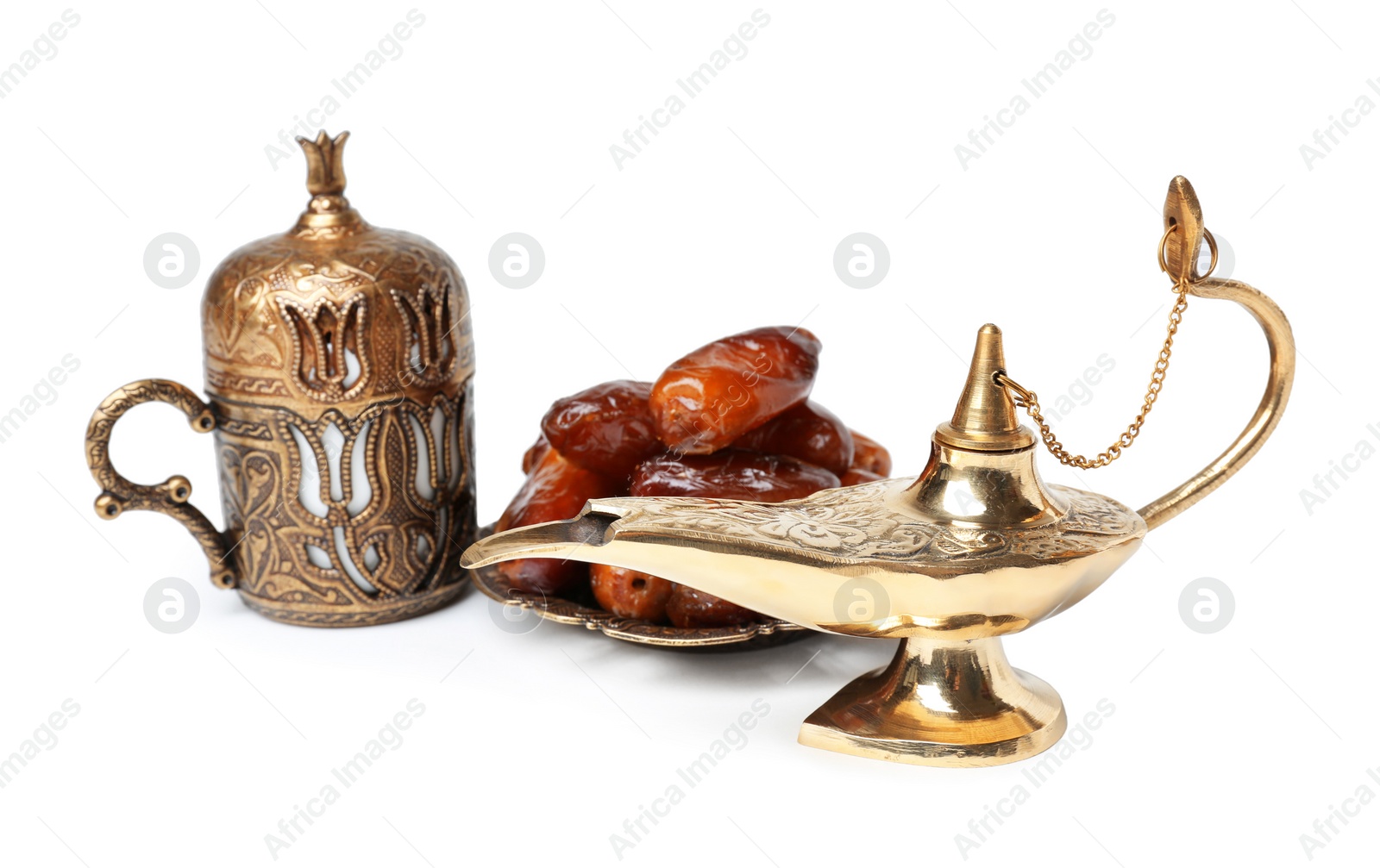 Photo of Aladdin magic lamp and dates on white background