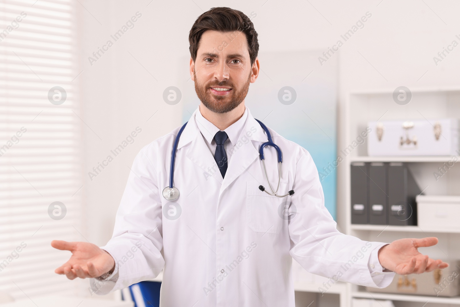 Photo of Portrait of medical consultant with stethoscope in clinic