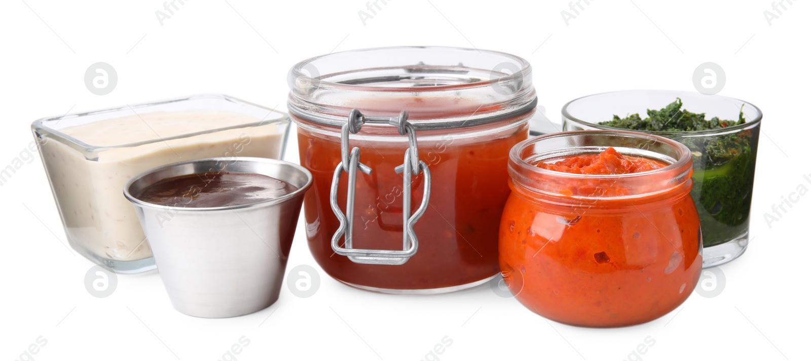 Photo of Different marinades in tableware isolated on white